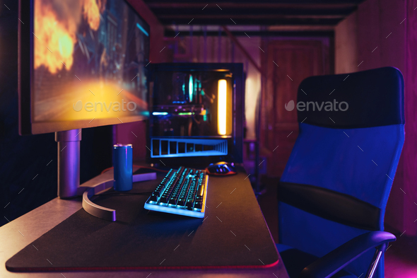 Professional gaming PC setup in neon room