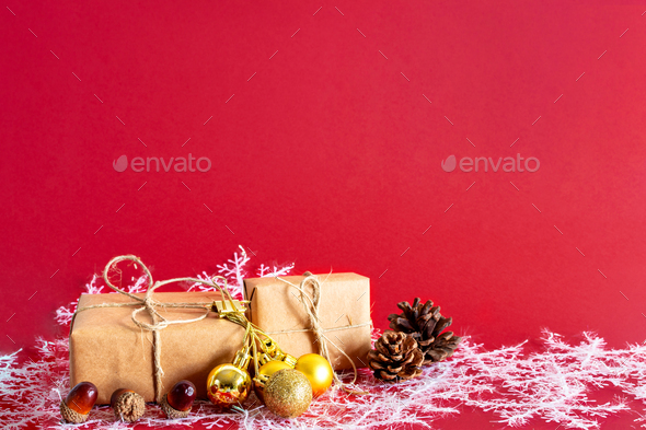 Homemade wrapped Presents on red background. Christmas and new year  concept. Stock Photo by wirestock