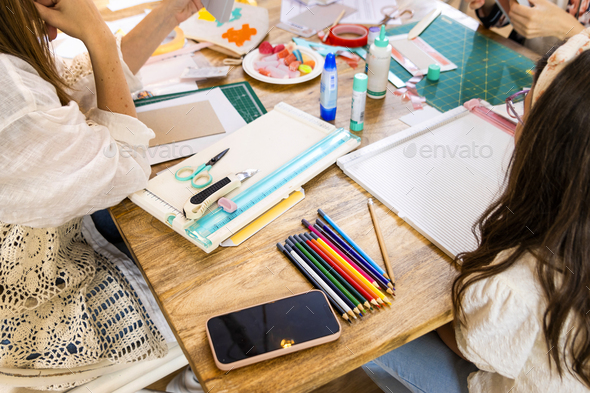 Scrap Booking Workshop. Materials and tools to create a book. Stock Photo  by solerfotostock
