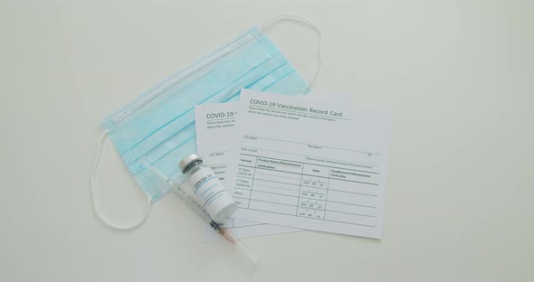Medical Mask and COVID19 Vaccine on Vaccination Record Card Approved By CDC with Corona Virus alt