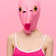 Very strange woman in a pink silicone fish mask for Halloween, crazy image  in pink clothes Stock Photo by shotprime