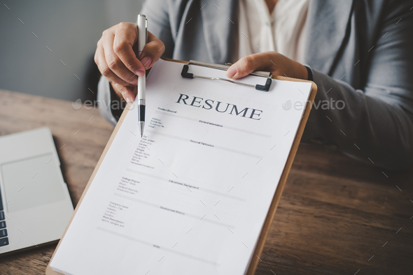 HR managers offer job applications to job applicants to fill out a resume on the job
