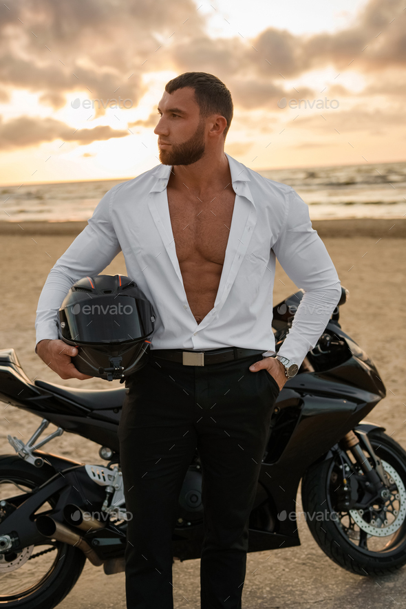 Man Standing Beside Motorcycle · Free Stock Photo
