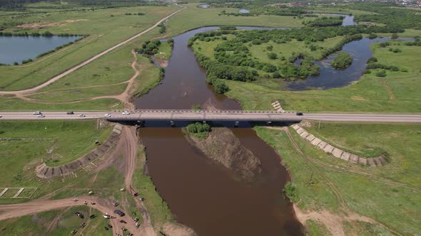 Aerial Drone Shot of Cows Grazing on Pasture Landscape alt