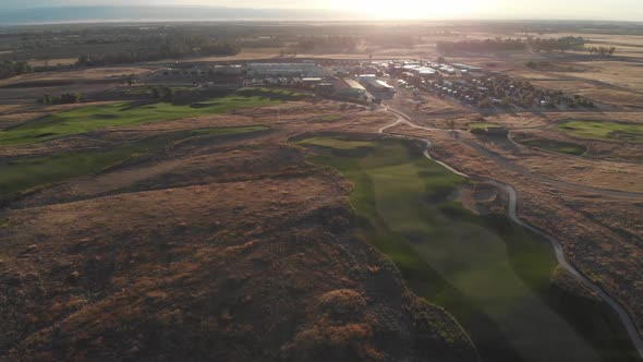 Aerial flight back to campground and golf course clubhouse in the early morning hours.  Lush, perfec alt