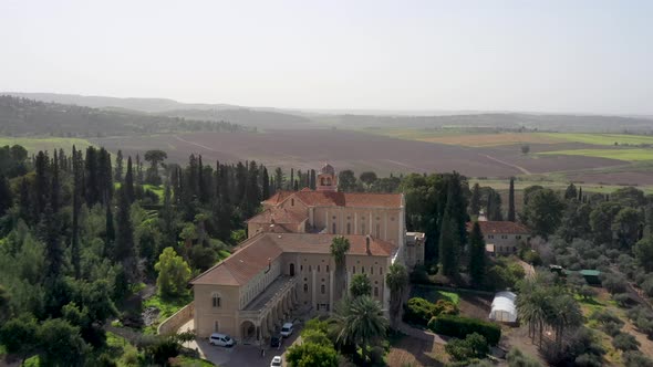Latrun Trappist Monastery, Israel, Fly over drone shot, green forest alt