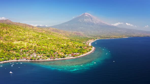 Panoramic View of the Jemeluk Bay, Amed Village, the Agung Volcano Mountains and the Azure Sea in alt