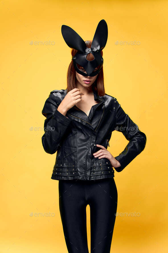 Sexy woman in rabbit mask and black suit, temptation Stock Photo by