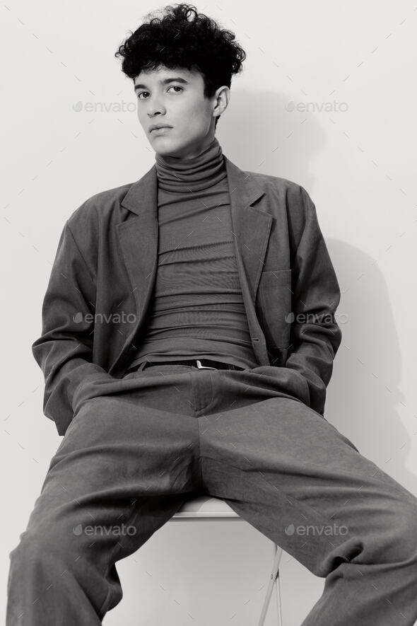 Confident Handsome Man in Elegant Suit Posing Sitting in Chair Stock Photo  - Image of retro, macho: 148987118