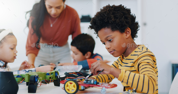 Technology, boy and car robotics at school for learning, education or electronics with car toys for