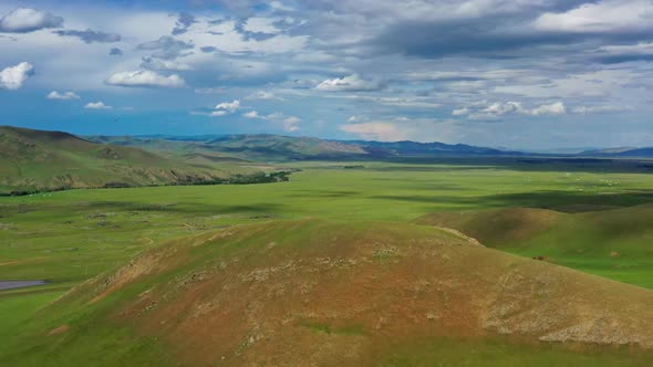 Aerial View of Steppe and Mountains Landscape alt
