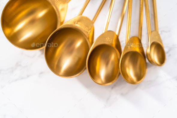 Measuring cups and spoons Stock Photo by arina-habich