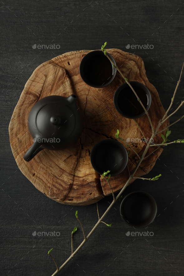 The concept of Asian tea, on a dark background with plants. Stock Photo