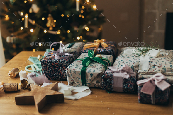 Wrapping christmas gifts. Stylish present, festive wrapping paper