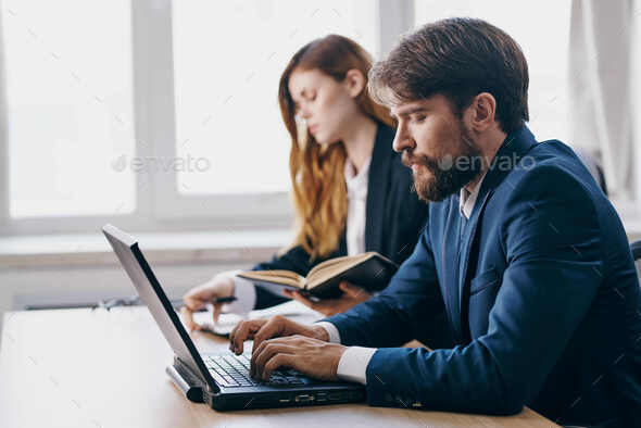 managers in the office in front of a laptop career network officials