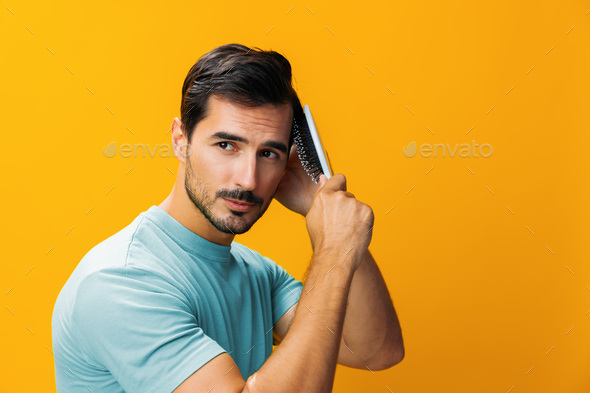 Man background portrait hairstyle barber hair comb studio handsome hair loss yellow brushing face