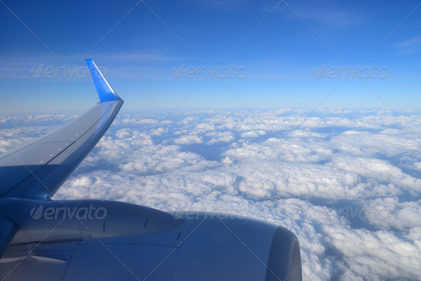 wing aircraft over clouds
