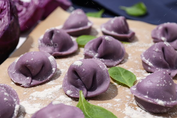 Purple dumplings on kitchen board and cabbage, close up Stock Photo by ...