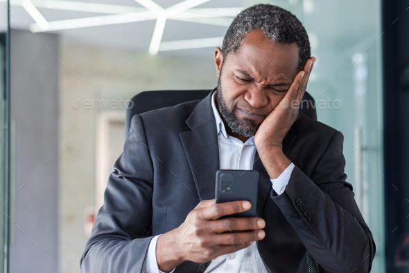Upset man received online notification message with bad news, boss disappointed in despair reading