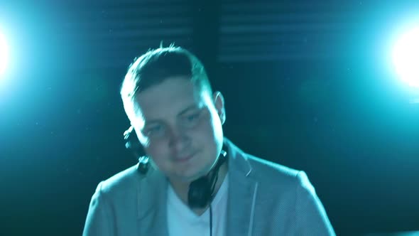 Talented DJ playing music at a night club