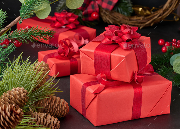 The ends of the red silk ribbon are sharply cut. Stock Photo by ndanko