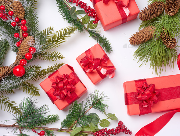 Christmas and Happy New Year red background with boxes, ribbons