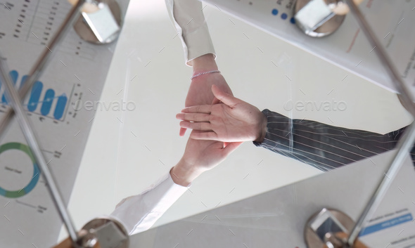 teamwork business Handshake concept, business team standing hand in hand, volunteer charity work