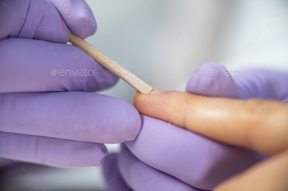 Nail care in our beauty salon. Close-up of a woman\'s hand, highlighting the expertise of technician