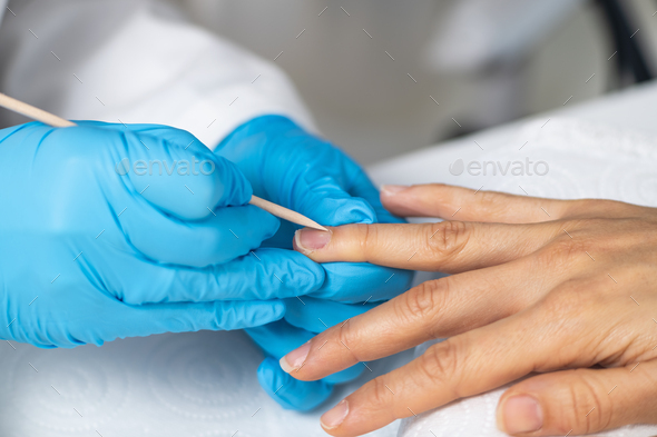 Nail care in our beauty salon. Close-up of a woman's hand, highlighting the expertise of technician