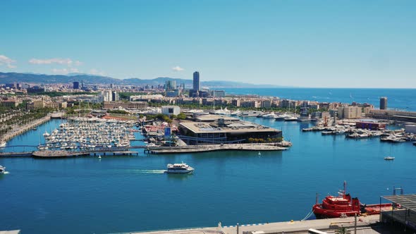 Port of Barcelona, the Top View. Below You Can See the Yachts and the Road with the Movement of Cars alt
