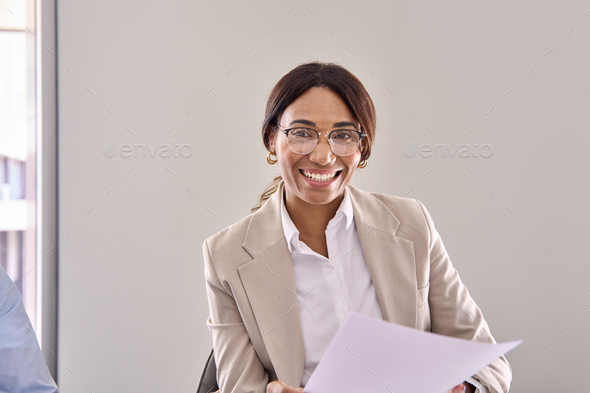 Smiling business woman hr or attorney consulting client at interview meeting.