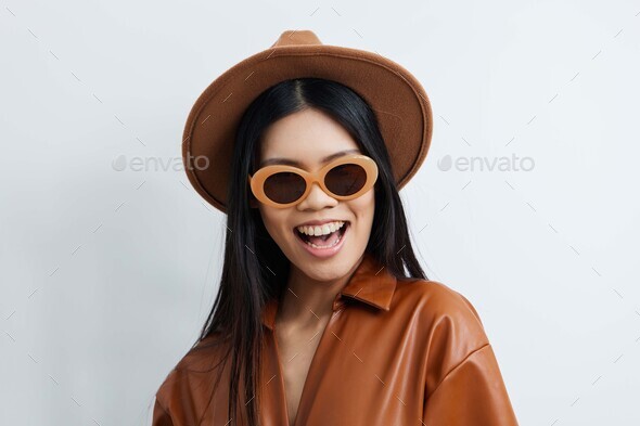 Handsome Asian man wearing round neck shirt over blur background serious  face with crossed arms looking at the camera Stock Photo - Alamy