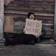 Homeless Man Sits and Holds Piece of Cardboard with Inscription Need Work - VideoHive Item for Sale
