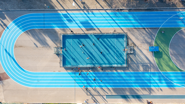 Street sports field with a football court and running track aerial view