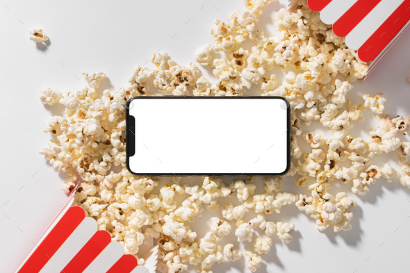 Classic popcorn buckets and smartphone with blank screen for your design