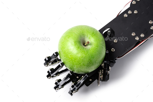 Real robot\'s hand with green apple.