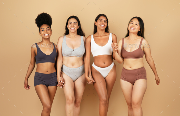 Diverse group of women in underwear, laughing together Stock Photo by  Prostock-studio