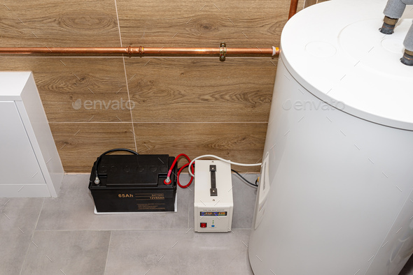 Modern gas boiler room lined with ceramic tiles imitating wood, emergency power supply 12V battery.