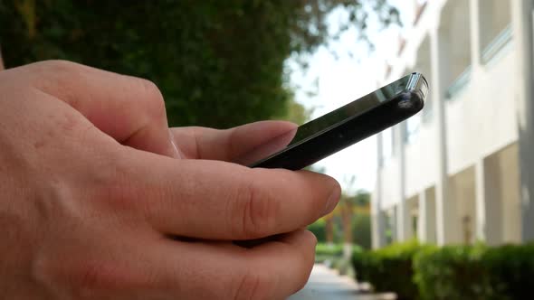 Man Using Touchscreen Black Smart Phone