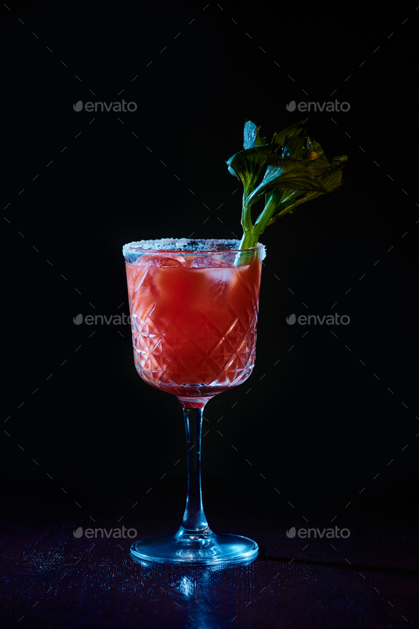 bloody mary cocktail in glasses garnished with lime and celery isolated on  white Stock Photo by LightFieldStudios