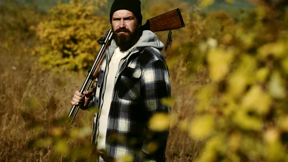Hunter Vintage. Hunting in Russia. Hunter with a Shotgun in a Vintage Shooting Clothing. alt