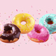 Assortment of falling brightly colored donuts with falling sprinkles - PhotoDune Item for Sale