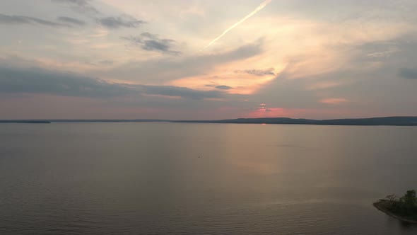 Sunset viewed by drone over the sea in bay with islands and pretty sky alt