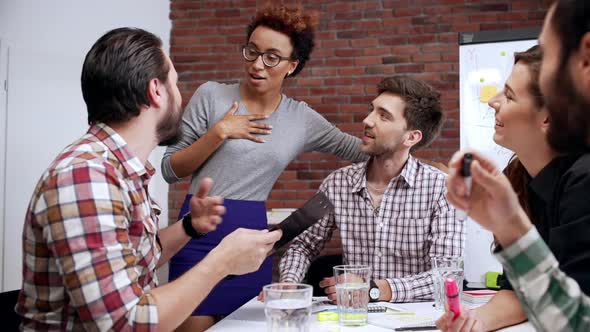 Black Woman Ceo Team Leader Talking to Employee in Funny Friendly Way