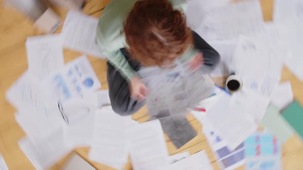 Female Freelancer Doing Paperwork alt