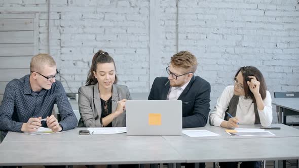 Four Ambitions Person Planning New Startup Strategy in Office