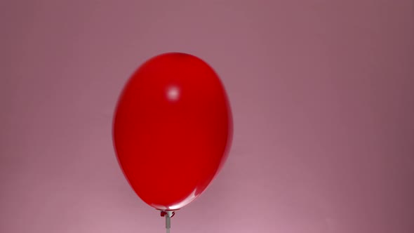 Heart Shape Balloon Rotate on Pink Background