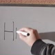 Hand writing the word HELLO on white blackboard - VideoHive Item for Sale