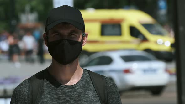 Undercover Police Provocateur Agent in Covid19 Face Mask Among Rally Crowd alt