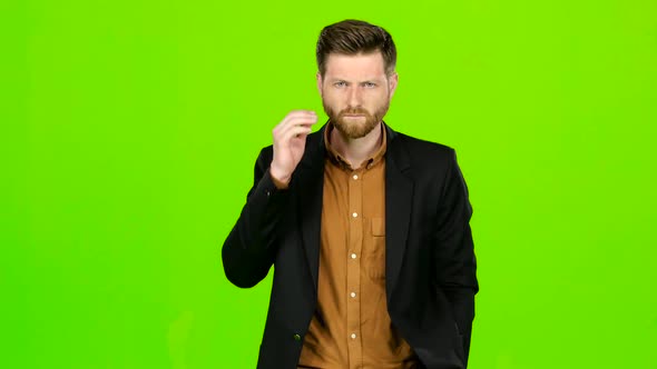 Man Is Suffering, His Head Hurts, He Is Tired. Green Screen alt